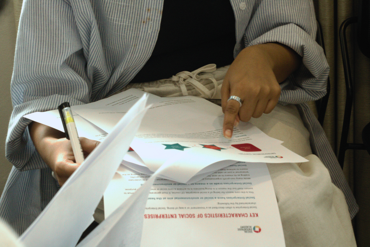 Participant completing an impact measurement activity